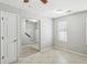 Bright and airy bedroom with tiled floors, closet, and window at 543 Harbor Lake Ct, Marietta, GA 30066