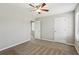 Carpeted bedroom with ceiling fan, neutral paint and two bright windows at 543 Harbor Lake Ct, Marietta, GA 30066