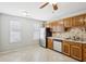 Kitchen featuring ample cabinet space, tile floors, and modern appliances at 543 Harbor Lake Ct, Marietta, GA 30066