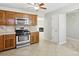 Bright kitchen featuring oak cabinets, stainless steel appliances, and tile floor at 543 Harbor Lake Ct, Marietta, GA 30066
