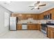 Bright kitchen featuring oak cabinets, stainless steel appliances, and tile backsplash at 543 Harbor Lake Ct, Marietta, GA 30066