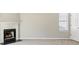 Living room features a fireplace, bright window, and neutral paint at 543 Harbor Lake Ct, Marietta, GA 30066