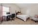 Cozy bedroom with neutral carpet, a twin bed, and a desk beneath the window at 6525 Oak Highlands Ct, Cumming, GA 30041