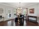 Bright breakfast nook features hardwood floors, a cozy bench seat, and direct access to outdoor entertaining spaces at 6525 Oak Highlands Ct, Cumming, GA 30041