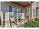 Inviting front porch with rocking chairs creating a cozy and welcoming entrance to the home at 6525 Oak Highlands Ct, Cumming, GA 30041