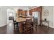 Well-equipped kitchen boasts wood cabinetry, granite countertops, and functional island with seating at 6525 Oak Highlands Ct, Cumming, GA 30041