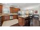 Modern kitchen featuring granite countertops, stainless steel appliances, and a center island with bar seating at 6525 Oak Highlands Ct, Cumming, GA 30041