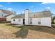 View of a newly renovated ranch-style home featuring a well-maintained backyard and exterior at 6800 Bells Landing Way, Rex, GA 30273
