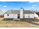Backyard featuring a view of the back of the house at 6800 Bells Landing Way, Rex, GA 30273