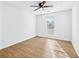 Bright bedroom with a ceiling fan and wood look floors at 6800 Bells Landing Way, Rex, GA 30273