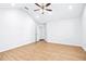 Bright bedroom with a vaulted ceiling, ceiling fan, and wood look floors at 6800 Bells Landing Way, Rex, GA 30273