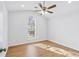 Bright bedroom featuring vaulted ceiling, large window with natural light and hardwood floors at 6800 Bells Landing Way, Rex, GA 30273