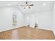 Bright bedroom with a vaulted ceiling, ceiling fan, and wood look floors at 6800 Bells Landing Way, Rex, GA 30273