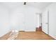 Bedroom featuring wood-look flooring and access to another room at 6800 Bells Landing Way, Rex, GA 30273