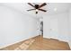 Bright bedroom with a ceiling fan and wood look floors at 6800 Bells Landing Way, Rex, GA 30273