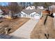 Charming single-Gathering home boasts a well-manicured lawn and a long driveway leading to a one car garage at 6800 Bells Landing Way, Rex, GA 30273