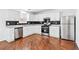 Modern kitchen featuring stainless steel appliances, updated cabinets, and stylish backsplash at 6800 Bells Landing Way, Rex, GA 30273