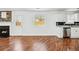 Spacious kitchen and fireplace combination with white cabinets and stainless appliances at 6800 Bells Landing Way, Rex, GA 30273