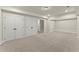 Large, unfinished basement featuring neutral carpets, plenty of storage space, and easy access to other areas at 1929 Quarry Park Nw Pl, Atlanta, GA 30318