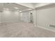 Finished basement boasts neutral carpet, three white doors, and recessed lighting at 1929 Quarry Park Nw Pl, Atlanta, GA 30318