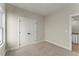 Neutral bedroom with a double closet for storage and easy access to the upper-level landing area at 1929 Quarry Park Nw Pl, Atlanta, GA 30318
