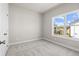 Bedroom with neutral carpet, base trim, and window at 1929 Quarry Park Nw Pl, Atlanta, GA 30318