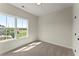 Cozy, light-filled bedroom with large windows offering pleasant outdoor views and ample natural light at 1929 Quarry Park Nw Pl, Atlanta, GA 30318