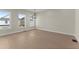 Light-filled dining area with hardwood flooring, offering views from the large windows at 1929 Quarry Park Nw Pl, Atlanta, GA 30318