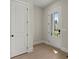 Bright entryway featuring light wood floors and a glass-paneled front door at 1929 Quarry Park Nw Pl, Atlanta, GA 30318