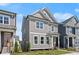 Gray two-story home with well-kept lawn and classic design elements at 1929 Quarry Park Nw Pl, Atlanta, GA 30318
