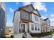 Charming two-story home featuring a combination of white siding, stone accents, and a covered front porch at 1929 Quarry Park Nw Pl, Atlanta, GA 30318