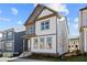 Two-story home with a combination of white siding, stone accents, and a covered front porch at 1929 Quarry Park Nw Pl, Atlanta, GA 30318