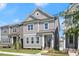 Attractive gray two-story home with manicured lawn, complemented by neighboring houses at 1929 Quarry Park Nw Pl, Atlanta, GA 30318