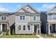 Charming two-story home with gray siding, white trim, and a well-maintained lawn at 1929 Quarry Park Nw Pl, Atlanta, GA 30318