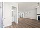 Spacious living room adjacent to an open kitchen and a powder room at 1929 Quarry Park Nw Pl, Atlanta, GA 30318