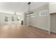 Bright living room featuring recessed lighting, fireplace, ceiling fan, and hardwood flooring at 1929 Quarry Park Nw Pl, Atlanta, GA 30318