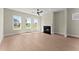 Spacious living room with three large windows, fireplace, and neutral color palette at 1929 Quarry Park Nw Pl, Atlanta, GA 30318