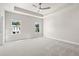 Large main bedroom with a ceiling fan and two windows at 1929 Quarry Park Nw Pl, Atlanta, GA 30318