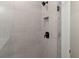 Close-up of the tiled shower with modern fixtures and a built-in niche at 1929 Quarry Park Nw Pl, Atlanta, GA 30318