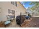 Backyard patio with grill, chairs, and ample space for entertaining at 330 Cottonwood Creek Cir, Canton, GA 30114