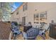 Backyard patio with grill, chairs, and firepit at 330 Cottonwood Creek Cir, Canton, GA 30114