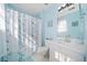 Bathroom featuring blue walls, vanity with sink, toilet, and shower with curtain at 330 Cottonwood Creek Cir, Canton, GA 30114