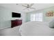 Bedroom features a spacious layout, TV, and a view from the window at 330 Cottonwood Creek Cir, Canton, GA 30114