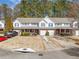 Exterior view of townhomes with garages and well-manicured lawns at 330 Cottonwood Creek Cir, Canton, GA 30114