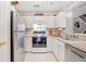 View of bright kitchen featuring stainless steel appliances and an open view to the living room at 330 Cottonwood Creek Cir, Canton, GA 30114