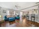 Open-concept living and dining area with hardwood floors, ample natural light, and stylish furnishings at 330 Cottonwood Creek Cir, Canton, GA 30114