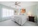 Main bedroom with large windows, soft carpet, ceiling fan, and a large comfortable bed at 330 Cottonwood Creek Cir, Canton, GA 30114