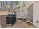 Back patio with grill, fenced perimeter, and sliding glass door at 330 Cottonwood Creek Cir, Canton, GA 30114