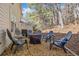 Back patio area with chairs, a fire pit, and gravel at 330 Cottonwood Creek Cir, Canton, GA 30114