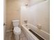 Modest bathroom featuring a standard tub and toilet at 4023 Snapfinger Way, Decatur, GA 30035